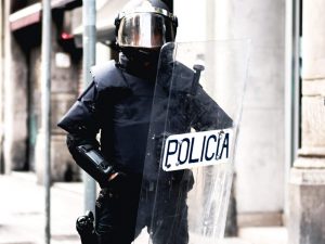 French police officers use riot shield for riot control