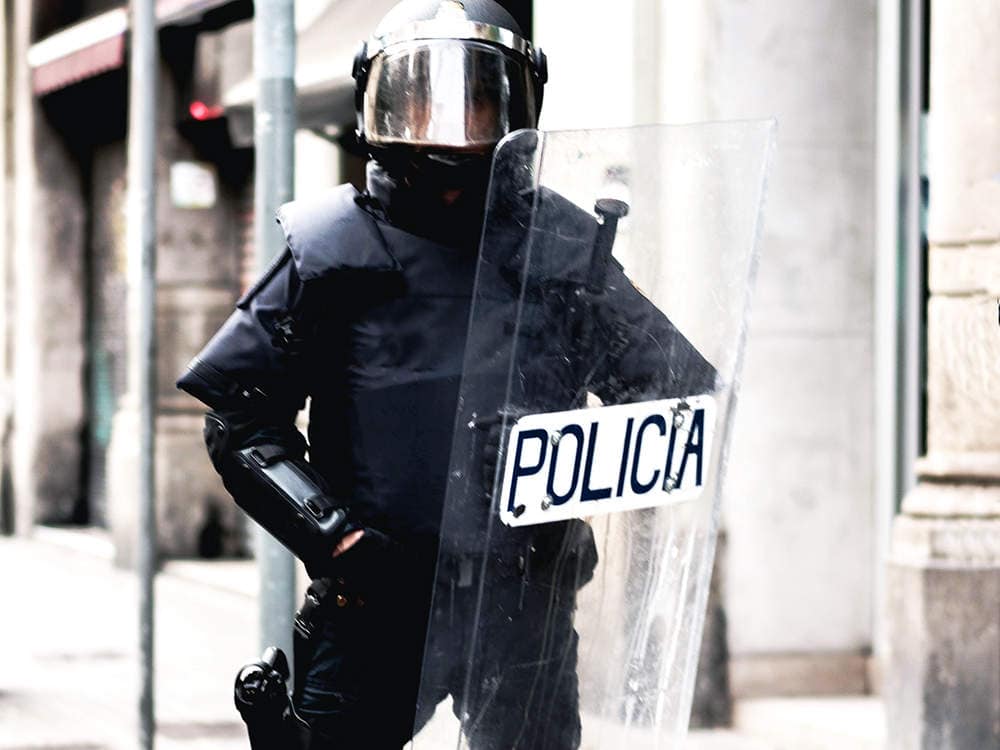 French police officers use riot shield for riot control